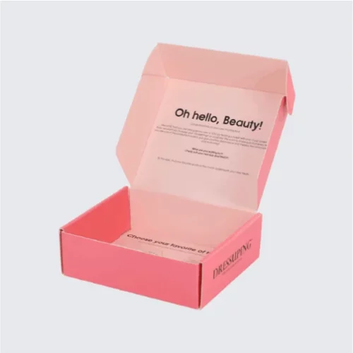 Stack of pink mailer boxes ready for shipping.