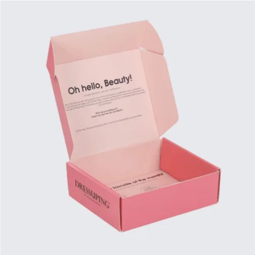 Open pink mailer box filled with beauty products.